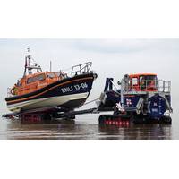 The RNLI has also introduced a new launch and recovery tractor, designed in conjunction with high-mobility-vehicles specialist Supacat Ltd, specifically for use with the Shannon. It acts as a mobile slipway. Pictured is the Hoylake, UK Shannon class lifeboat being recovered from the sea. (Photo: RNLI/Dave James)