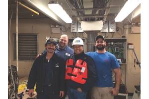 Ed Grimm, (second from left) CEO, Southern Towing Company during a crew visit.