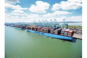 File Image: A typical Maersk boxship works cargo alongside a pier. (CREDIT: Maersk)