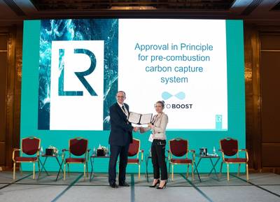 Andy McKeran, LR Chief Commercial Officer presents the AIP certificate to Kaisa Nikulainen, Rotoboost CEO. (Photo: Lloyd’s Register)