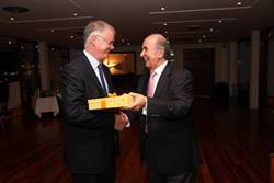 Ray Pomfret and Mathew Los, Chairman of the Greek Group, at the Yacht Club of Greece in Athens exchanging gifts.