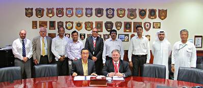 Terry McGowan, President and CEO, Thordon Bearings (seated right), and Mohammad Rizal (left), Chief Operating Officer of Drydocks World- Dubai, sign an agreement that affirms the two companies’ efforts to convert ships to seawater lubricated propeller shaft lines from oil (Photo: Thordon Bearings)