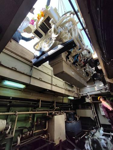 One of the new engines is lowered into the engine room. Image courtesy Cummins/Thai Marine Department