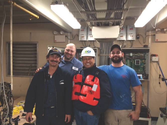 Ed Grimm, (second from left) CEO, Southern Towing Company during a crew visit.