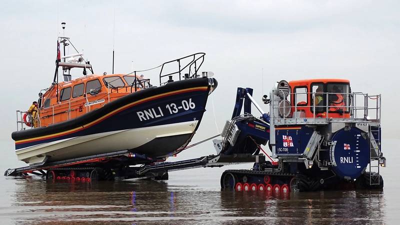 The RNLI has also introduced a new launch and recovery tractor, designed in conjunction with high-mobility-vehicles specialist Supacat Ltd, specifically for use with the Shannon. It acts as a mobile slipway.  Pictured is the Hoylake, UK Shannon class lifeboat being recovered from the sea. (Photo: RNLI/Dave James)