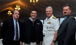 From Left: John O’Malley, owner and publisher, Marine Technology Reporter; Rob Howard, VP Sales & Marketing; U.S. Navy CNO Admiral Gary Roughead; and Greg Trauthwein, Associate Publisher and Editor. The CNO was conferred “Seamaster 2011” at the OceanTech Expo in Newport, RI. (Photo: U.S. Navy)