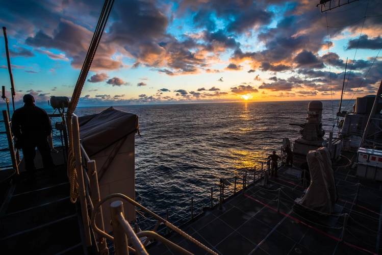 A Sailor observes the sunset aboard the guided-missile cruiser USS Bunker Hill (CG 52) (U.S. Navy photo by Peter G. Suess)