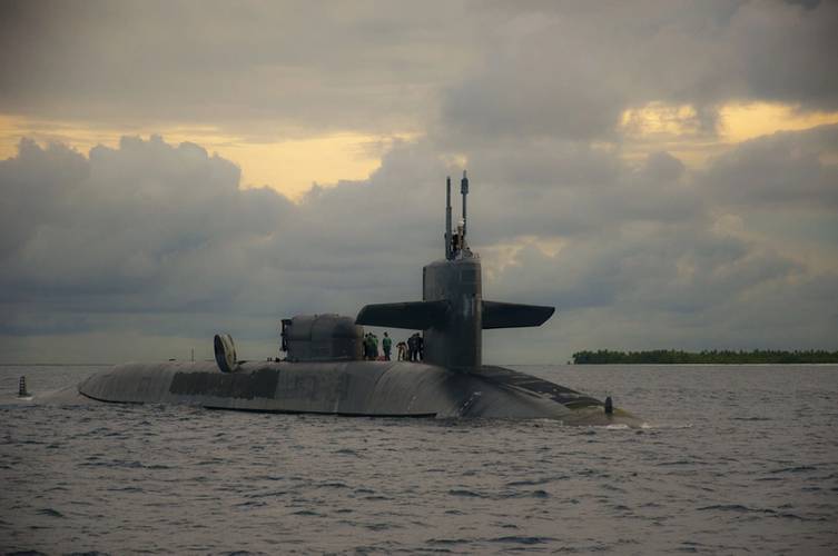 Sailors aboard the guided-missile submarine USS Georgia (SSGN 729) prepare to dock at U.S. Navy Support Facility Diego Garcia in British Indian Ocean Territory, December 2013 (U.S. Navy photo by Alex Smedegard)