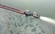 A barge loaded with marine fuel oil sits partially submerged in the Houston Ship Channel, March 22, 2014.
