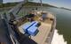 The boat’s crane is mounted to the front of the wheelhouse with controls on the wheelhouse deck level