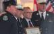 Bob Clark (second from right) from MetalCraft Marine presents the FDNY with a commemorative plaque. (Photo: Greg Trauthwein)