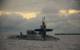 Sailors aboard the guided-missile submarine USS Georgia (SSGN 729) prepare to dock at U.S. Navy Support Facility Diego Garcia in British Indian Ocean Territory, December 2013 (U.S. Navy photo by Alex Smedegard)