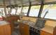The utilitarian galley is also in the wheelhouse along with a mess table and two bunks